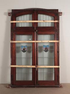 A four panel mahogany window set in frame with leaded glass having ship motif  - 3696132