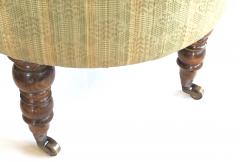 A handsome English oval ottoman stool with turned legs and casters - 1055774