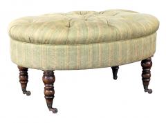A handsome English oval ottoman stool with turned legs and casters - 1055775