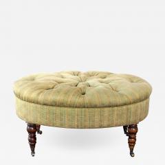 A handsome English oval ottoman stool with turned legs and casters - 1056214