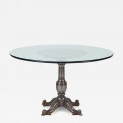 A heavy cast iron table with round glass top - 2590870