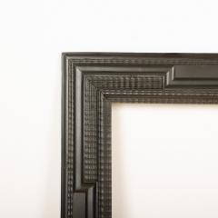 A large 19th C Dutch style ebonized carved wood frame mirror - 2107658