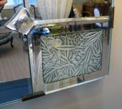 A large French art deco beveled mirror with pewter floral reserves - 59331