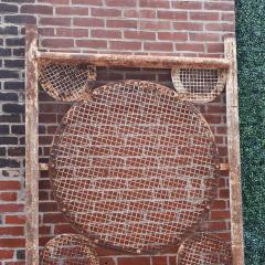 A large pair of iron panels with circle motif C 1940  - 4226179