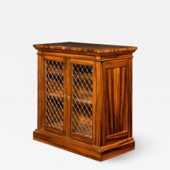 A late Regency Gon alo Alves two door side cabinet attributed to Gillows - 1188257