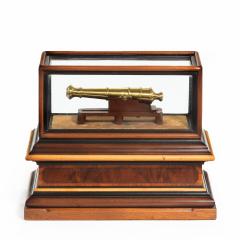 A miniature brass cannon in a presentation case - 1661536