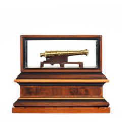 A miniature brass cannon in a presentation case - 1661538