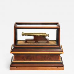 A miniature brass cannon in a presentation case - 1662420