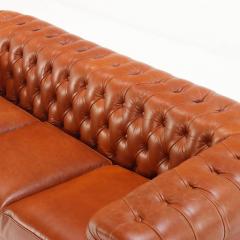 A pair of Chesterfield style leather sofas  - 4125354