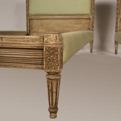 A pair of French Louis XVI style painted twin beds with upholstered headboards - 1886174