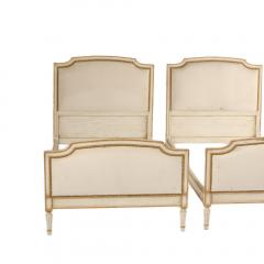 A pair of Louis XVI style painted twin beds with nail head upholstered headboard - 1843249