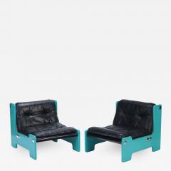 A pair of blue framed lounge chairs with black leather seats C 1970  - 2719983