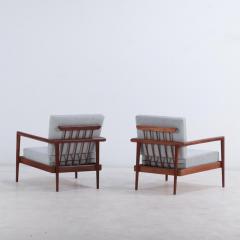 A pair of lounge chairs with Windsor style backs designed by Edmund Spence  - 3695977