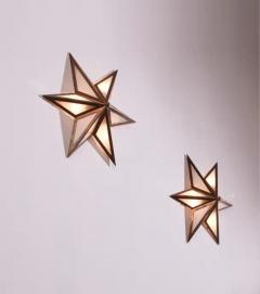 A pair of star shaped wall sconces made of brass and glass Italy 1960s - 3499290