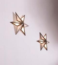 A pair of star shaped wall sconces made of steel and glass Italy 1960s - 3491947