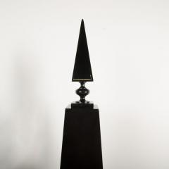 A pair of tall black decorative obelisks - 1832654