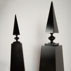 A pair of tall black decorative obelisks - 1832657