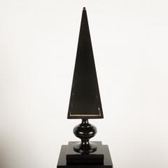 A pair of tall black decorative obelisks - 1832669