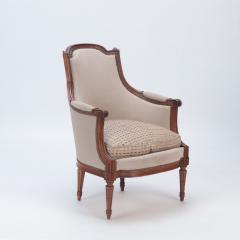 A pair of upholstered Louis XVI style walnut bergeres circa 1940  - 2711140