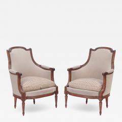 A pair of upholstered Louis XVI style walnut bergeres circa 1940  - 2719977