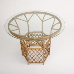 A rattan dining room table and four chairs circa 1950 - 1681185