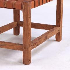 A rustic French wood bench with woven leather seat C 1930  - 4228580