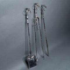 A set of Arts Crafts Cotswold School polished steel hand wrought fire utensils - 4188901