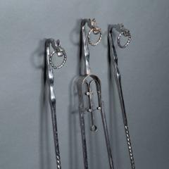 A set of Arts Crafts Cotswold School polished steel hand wrought fire utensils - 4188903