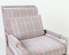 A spool framed chair with upholstered seat back cushion semi attached bolster - 2202979