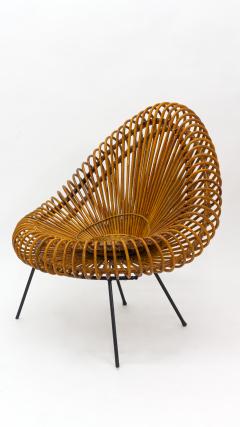 A stylish rattan and iron chair designed by Janine Abraham  - 1857157