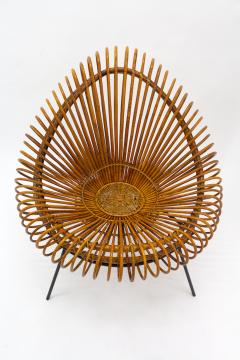 A stylish rattan and iron chair designed by Janine Abraham  - 1857168