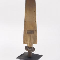 A tall nickel over brass French glove form mold sculpture on an iron stand  - 3468360