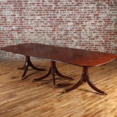 A thirteen foot triple pedestal mahogany dining table with leaves circa 1940  - 3477382