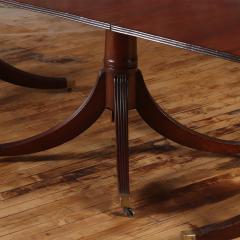 A thirteen foot triple pedestal mahogany dining table with leaves circa 1940  - 3477384