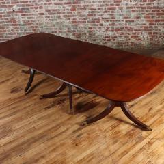 A thirteen foot triple pedestal mahogany dining table with leaves circa 1940  - 3477385