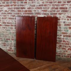 A thirteen foot triple pedestal mahogany dining table with leaves circa 1940  - 3477386