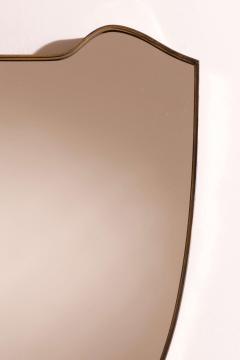 A wall mirror with brass frame Italy 1950s - 4353137