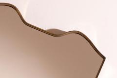 A wall mirror with brass frame Italy 1950s - 4353143