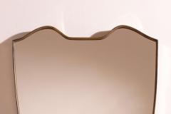 A wall mirror with brass frame Italy 1950s - 4353144