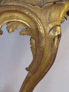 A well carved Italian rococo gilt wood wall console table with marble top - 993975