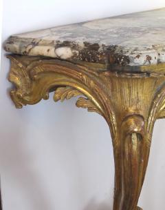 A well carved Italian rococo gilt wood wall console table with marble top - 993976