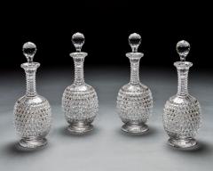 AN ELABORATELY CUT SUITE OF DECANTERS - 3787893
