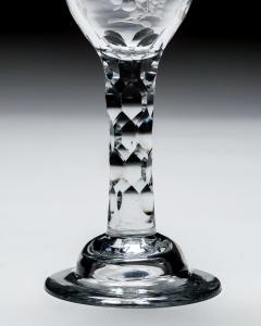 AN ELEGANT ENGRAVED FACET STEM WINE GLASS - 4752677