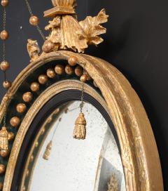 AN ENGLISH REGENCY GILTWOOD CONVEX MIRROR - 4267584