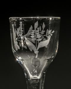 AN ENGRAVED PLAIN STEM WINE GLASS - 3792887