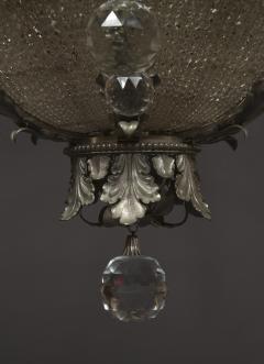 AN UNUSUAL FINELY CAST AND SILVERED BRONZE FACETED GLASS MOUNTED CHANDELIER - 3906463