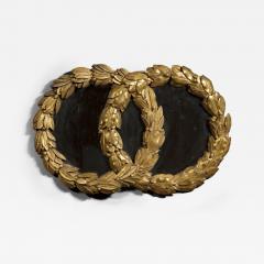 AN UNUSUAL NEOCLASSICAL MIRROR IN THE FORM OF INTERLOCKING LAUREL WREATHS - 4226920
