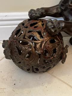 ANTIQUE PATINATED IRON FOO DOG WITH GILT BALL WITH FLOWERS SCULPTURE - 3598101