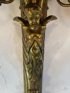 ART NOUVEAU FRENCH BRONZE CUPID SCONCE WITH THREE FANCY GLASS FLOWER SHADES - 1851500