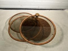 Adrian Pearsall MODERNIST TRIPLE TIER WICKER AND AMBER GLASS SWIVELING COFFEE TABLE - 2809883